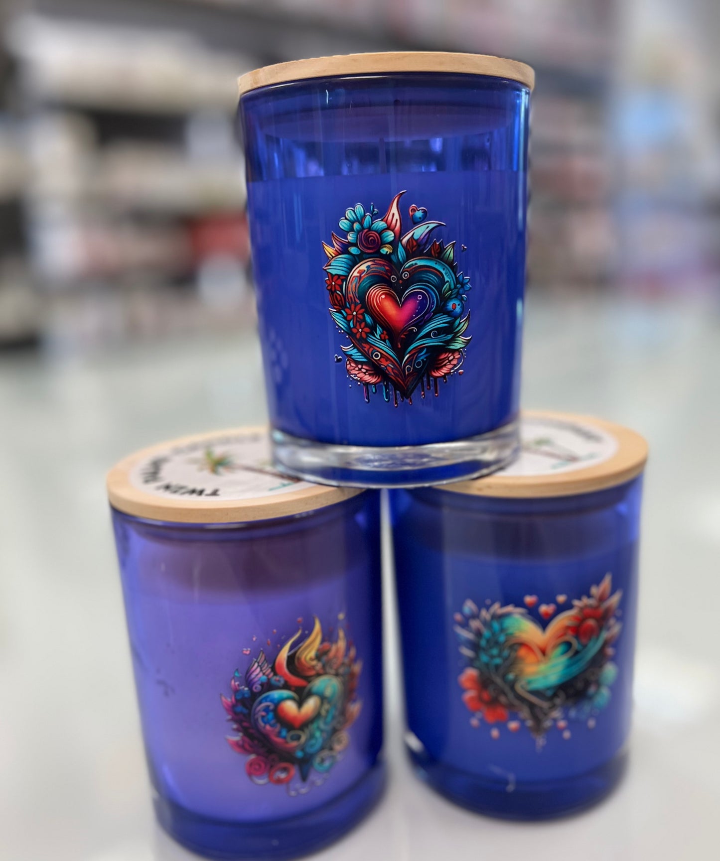 Ocean Mist Blue Para-Soy candle by The Bubble Bath Shop, showing a blue para-soy wax candle in a clear glass container.