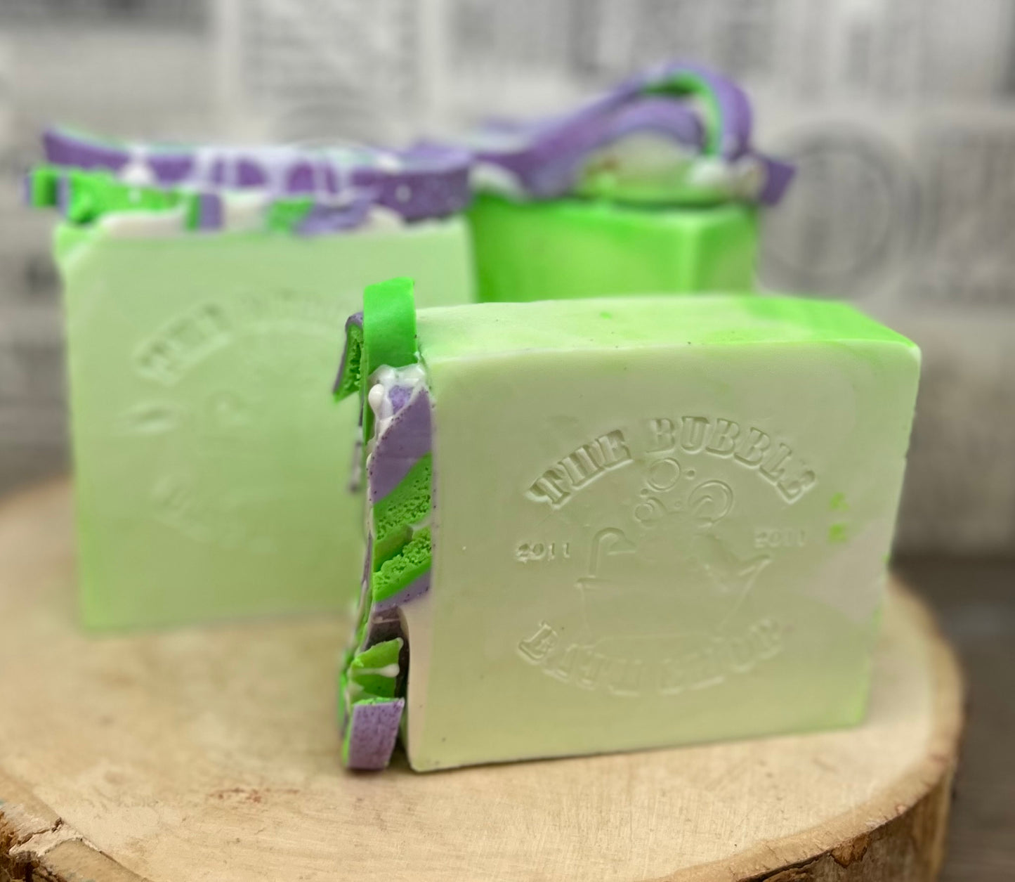 Black Hemlock goat milk soap by The Bubble Bath Shop, creamy soap bar with black hemlock botanical details.