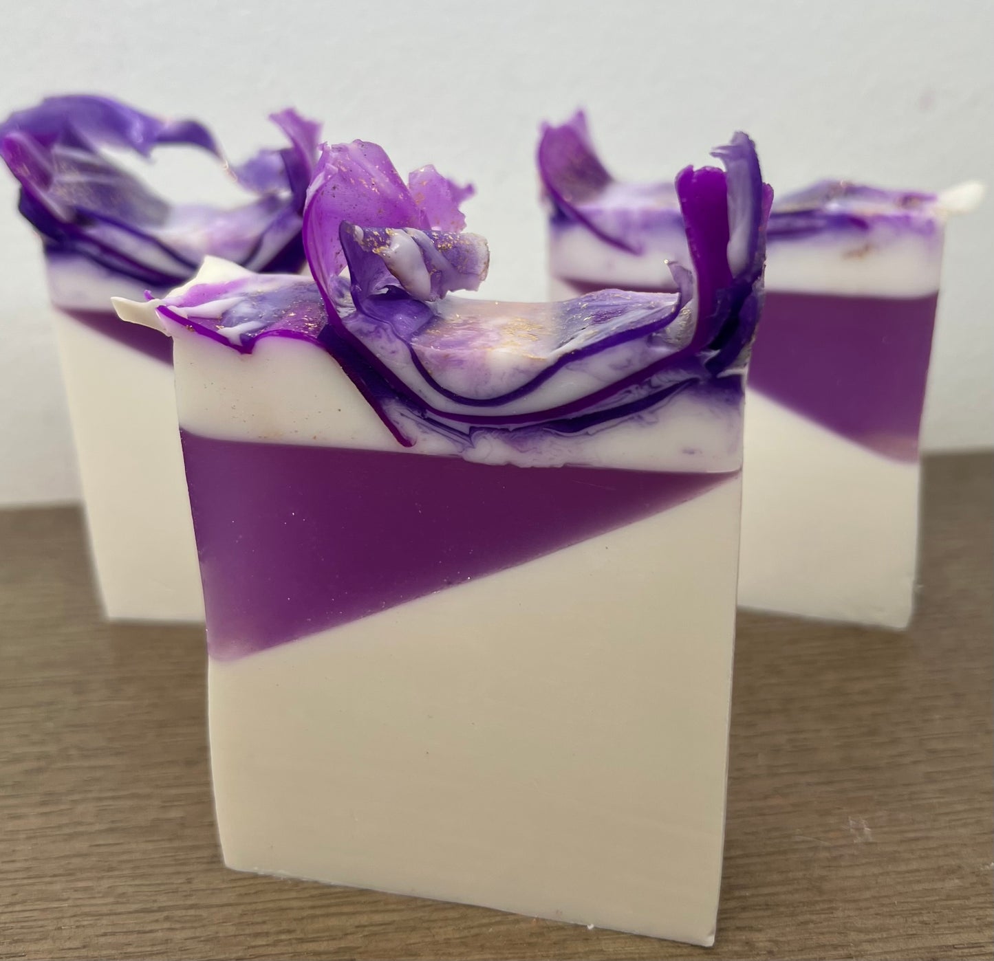 Lavender essential oil goat milk soap from The Bubble Bath Shop, showing a bar of soap with lavender flowers and goat milk ingredients.
