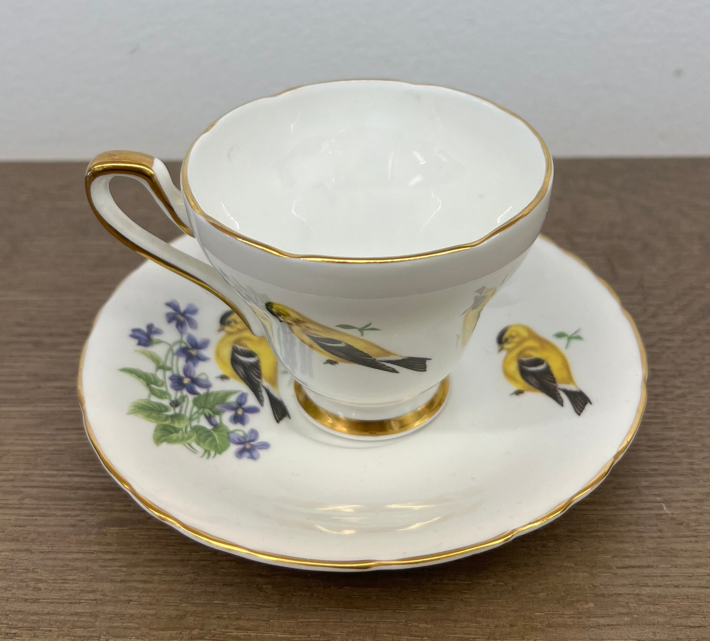 SUTHERLAND CUP AND SAUCER WITH YELLOW BIRD