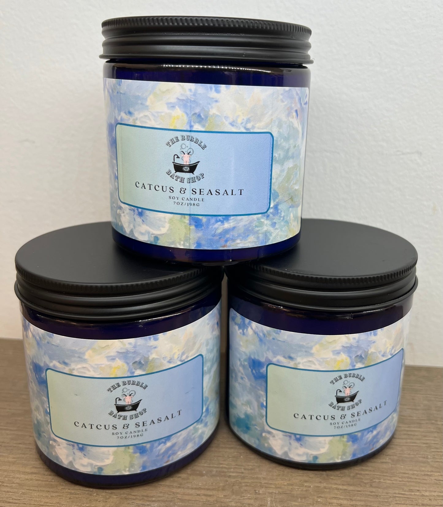 Cactus Seasalt Soy Candle by The Bubble Bath Shop, showing a stylish candle with a cactus and seasalt scent label.