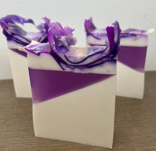 Lavender essential oil goat milk soap from The Bubble Bath Shop, showing a bar of soap with lavender flowers and goat milk ingredients.